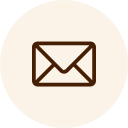 Icon of an envelope outlined in dark brown on a light beige circular background, reminiscent of vintage correspondence often used by veterinarians.